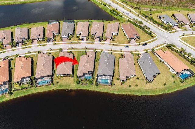 birds eye view of property featuring a water view