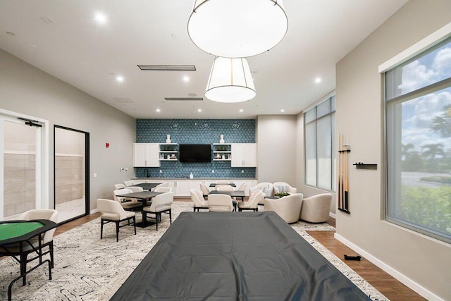 recreation room featuring light wood-type flooring