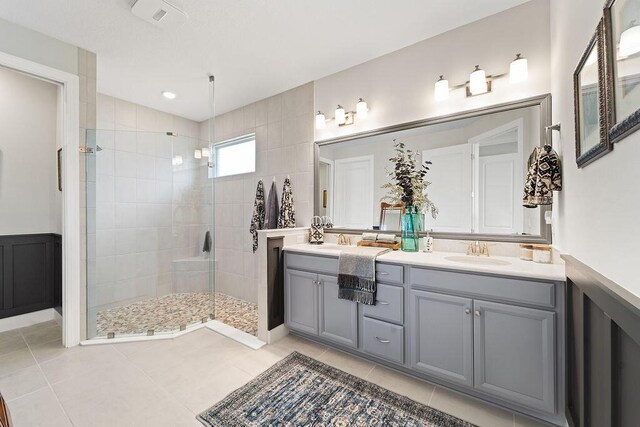 dining room with a chandelier, light tile patterned floors, a tray ceiling, and crown molding