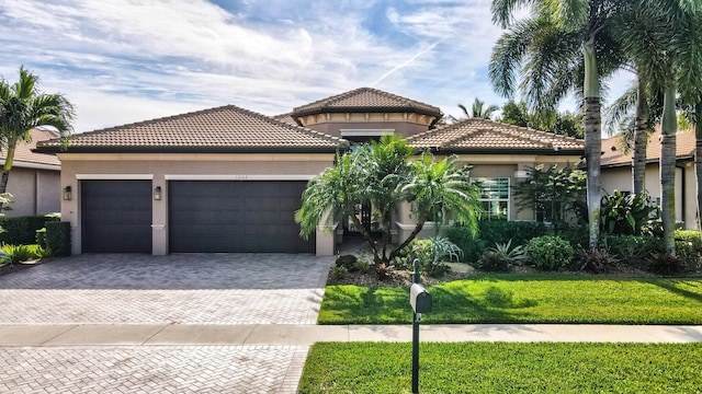 mediterranean / spanish-style home featuring a garage