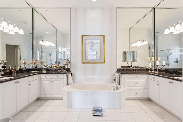 bathroom with plus walk in shower, vanity, and tile patterned floors