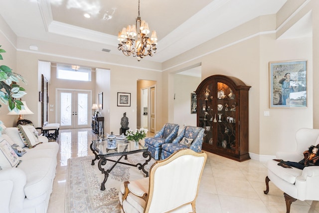 tiled living room with a chandelier, french doors, a raised ceiling, and ornamental molding