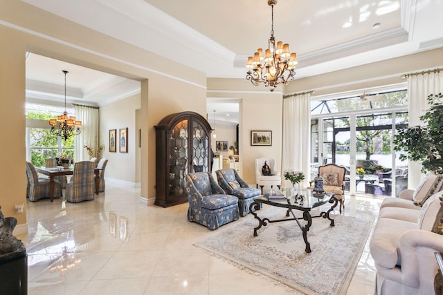 tiled living room featuring a raised ceiling, crown molding, and an inviting chandelier