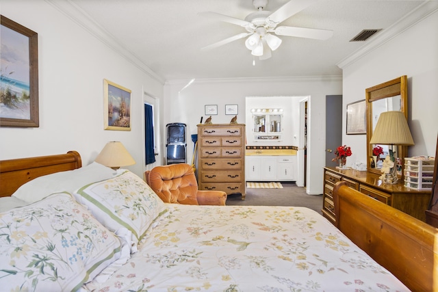 carpeted bedroom featuring ceiling fan, ornamental molding, and ensuite bath