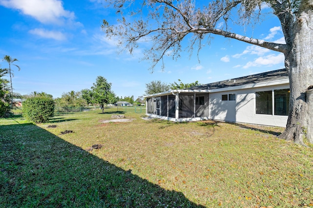 view of yard with a sunroom