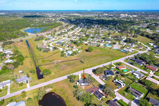 drone / aerial view with a water view