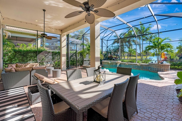 view of patio with ceiling fan, a pool with hot tub, a lanai, and an outdoor living space