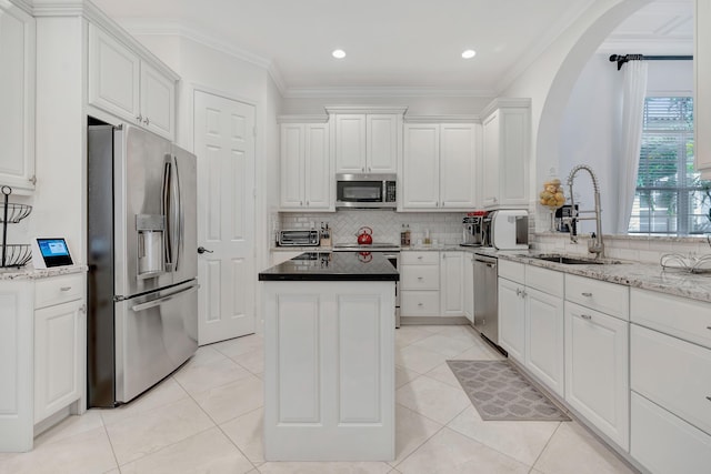 kitchen with white cabinetry, sink, and appliances with stainless steel finishes