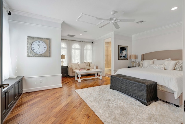 bedroom with ensuite bath, ceiling fan, crown molding, and light hardwood / wood-style flooring