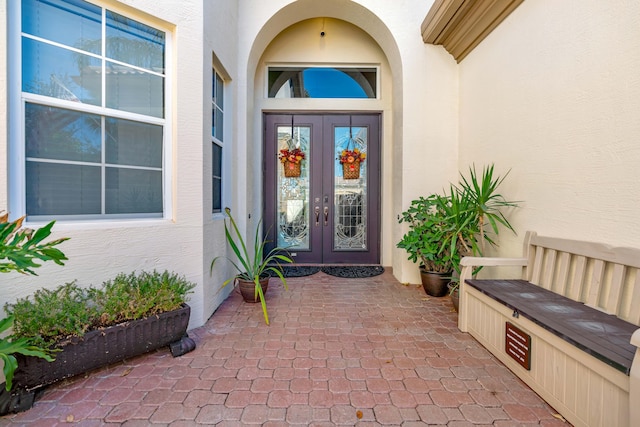 entrance to property featuring french doors