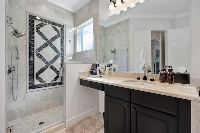 bathroom with vanity, a shower with door, and crown molding