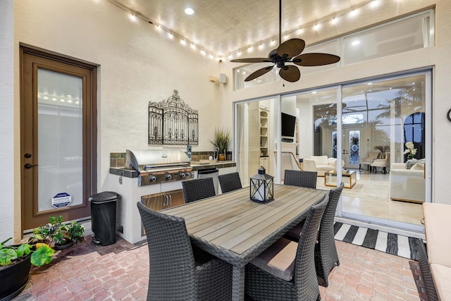 view of patio / terrace with ceiling fan and grilling area