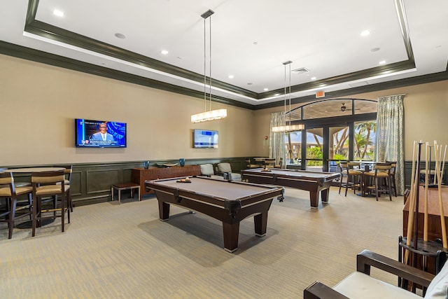 recreation room featuring light carpet, french doors, a raised ceiling, billiards, and ornamental molding