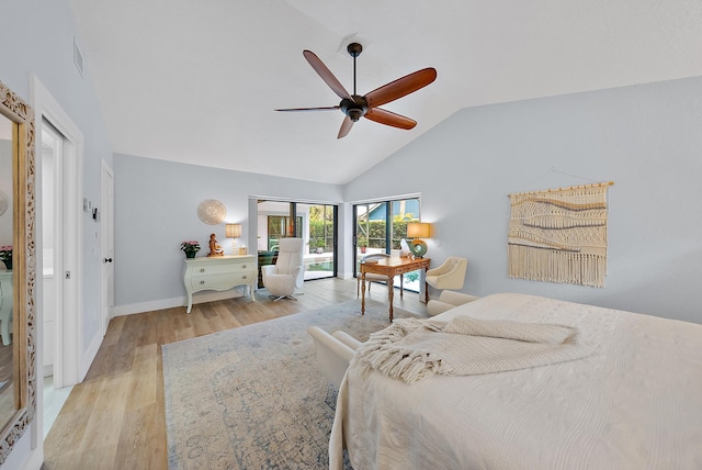 bedroom featuring ceiling fan, light wood-type flooring, and vaulted ceiling