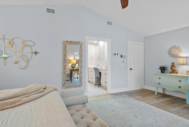 bedroom with ceiling fan, ensuite bathroom, high vaulted ceiling, and light hardwood / wood-style floors