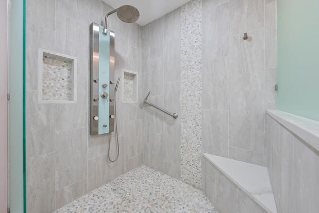 bathroom featuring tiled shower