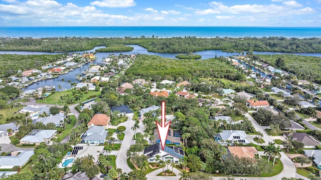 birds eye view of property featuring a water view