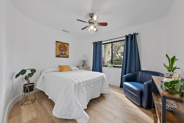 bedroom with ceiling fan and light hardwood / wood-style floors