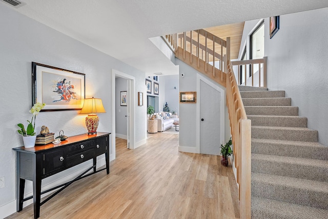 stairway with wood-type flooring