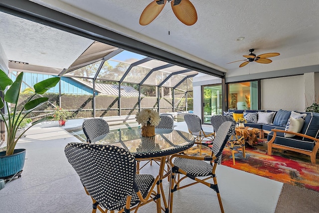 view of patio with an outdoor hangout area, ceiling fan, and a lanai