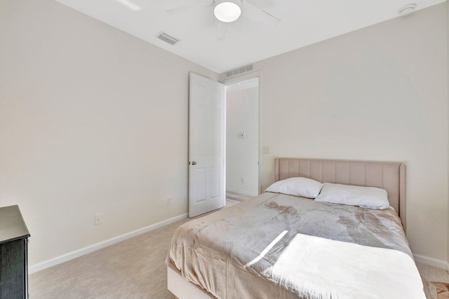 bedroom featuring light carpet, baseboards, ceiling fan, and visible vents