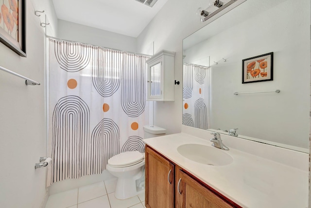 bathroom with tile patterned floors, a shower with curtain, vanity, and toilet