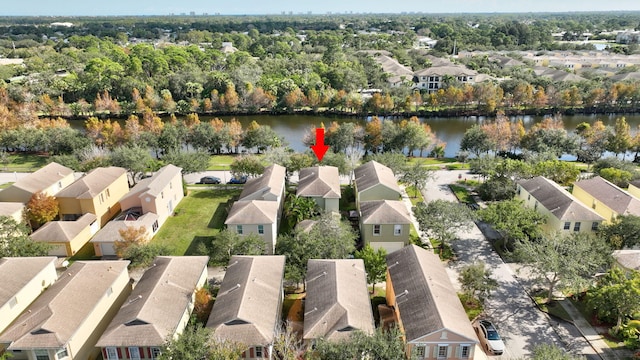 drone / aerial view with a residential view and a water view