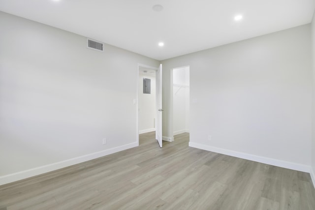 unfurnished room with light hardwood / wood-style flooring