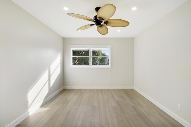 unfurnished room with ceiling fan and light hardwood / wood-style flooring