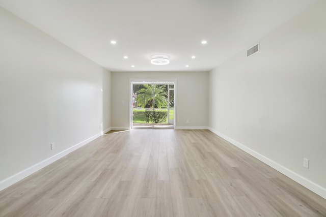 empty room with light hardwood / wood-style floors