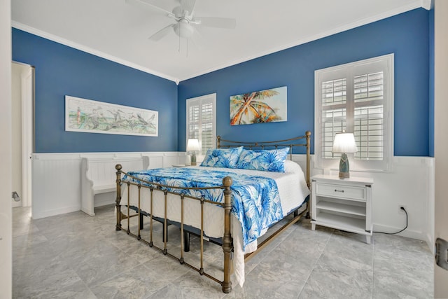 bedroom with ceiling fan and crown molding