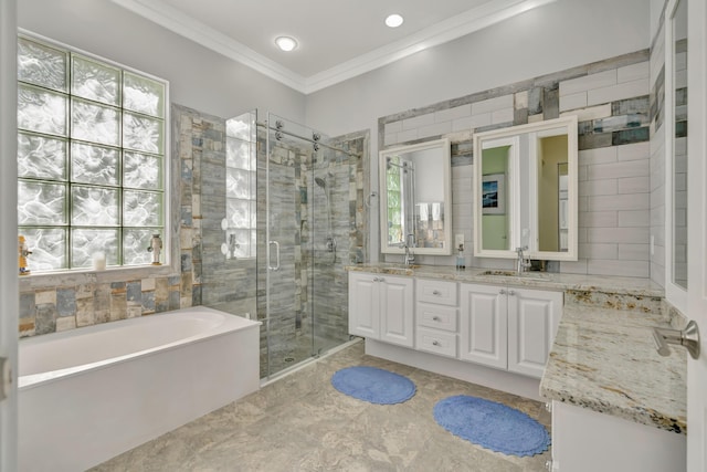 bathroom with vanity, separate shower and tub, plenty of natural light, and ornamental molding