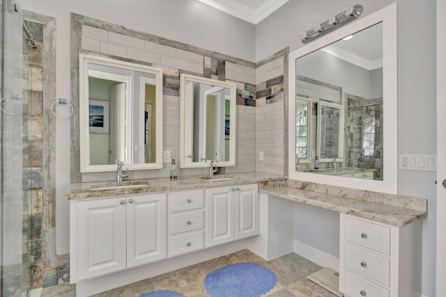 bathroom with vanity, a shower with shower door, and crown molding