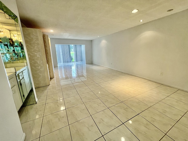 empty room featuring a textured ceiling