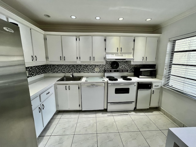 kitchen with backsplash, white cabinets, sink, ornamental molding, and stainless steel appliances