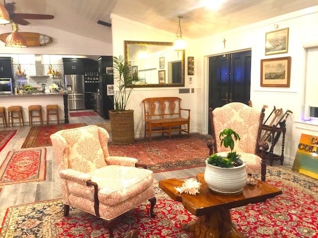 living room with hardwood / wood-style flooring, wood ceiling, and vaulted ceiling