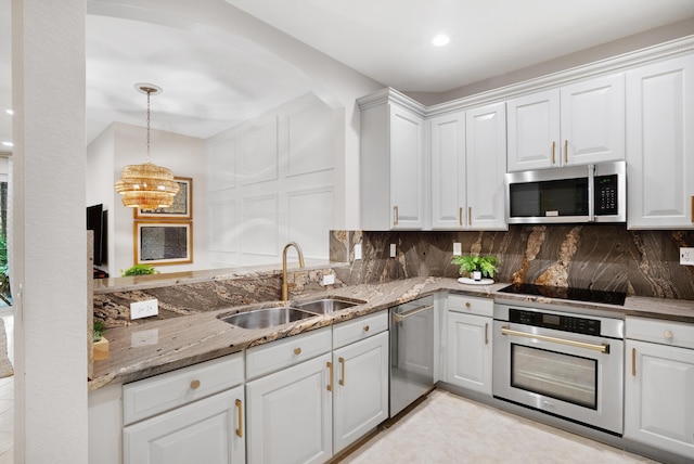 kitchen featuring white cabinets, backsplash, sink, and stainless steel appliances