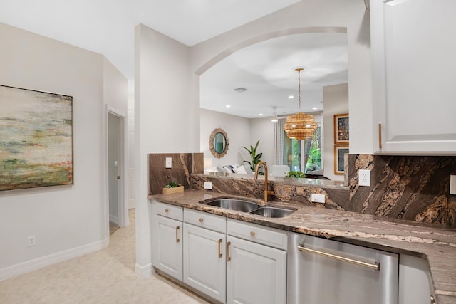 kitchen with dishwasher, white cabinetry, sink, and tasteful backsplash