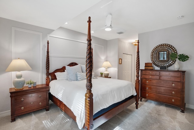 bedroom with ceiling fan and light colored carpet