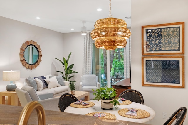 dining space featuring a notable chandelier