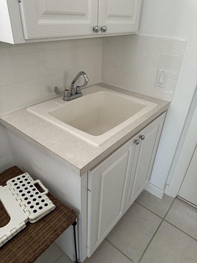 bathroom with vanity, backsplash, and tile patterned floors