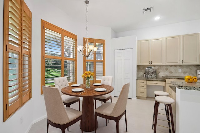 dining room with a chandelier