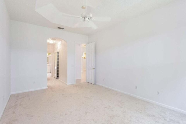 unfurnished room with ceiling fan and light colored carpet