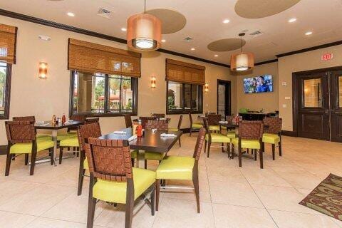 tiled dining space with ornamental molding