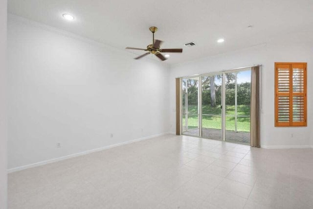 unfurnished room with ceiling fan and ornamental molding