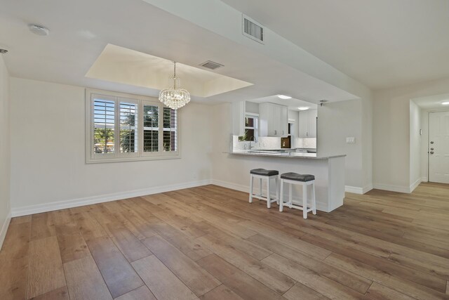 spare room with ceiling fan and light hardwood / wood-style flooring