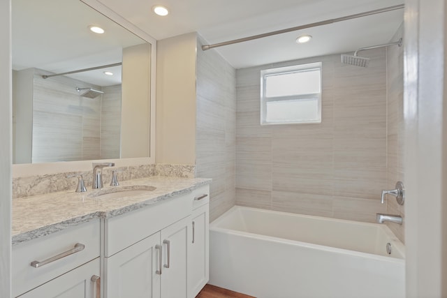 bathroom with recessed lighting, shower / tub combination, and vanity