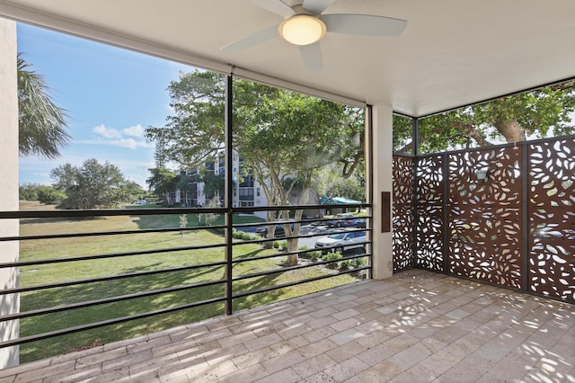 unfurnished sunroom featuring a wealth of natural light