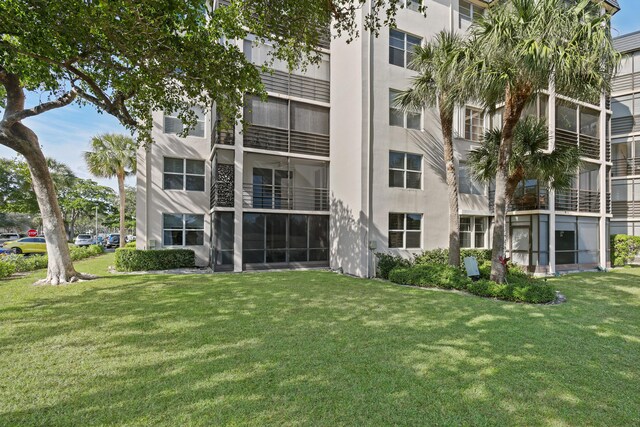 exterior space featuring ceiling fan and a balcony