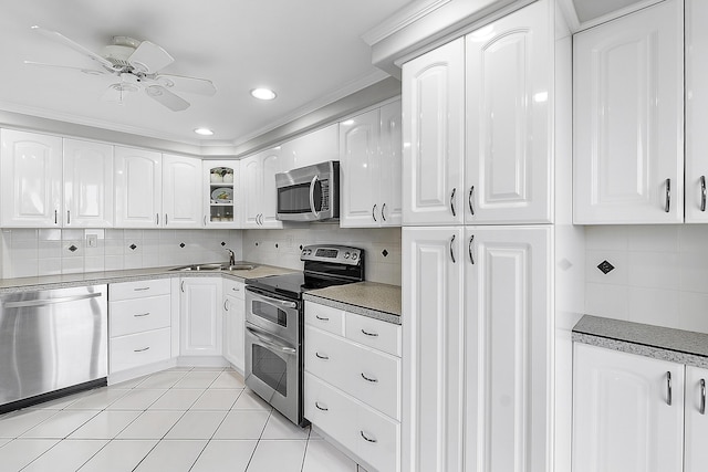 kitchen featuring white cabinets, appliances with stainless steel finishes, and ceiling fan